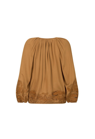 a-camel-brown-long-sleeve-blouse-with-a-gathered-pleated-neckline-and-matching-embroidered-detailing-along-the-lower-sleeves-and-hem-shown-against-a-plain-white-background