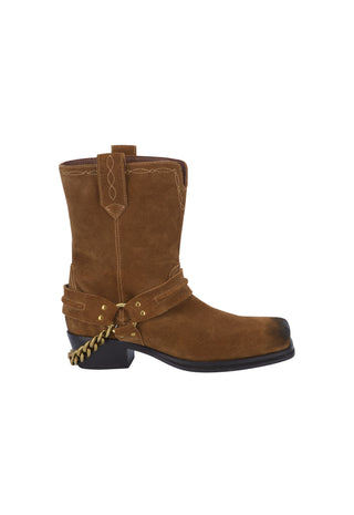 a-brown-ankle-boot-with-a-chunky-block-heel-featuring-a-black-faux-leather-upper-a-brown-suede-side-panel-a-brown-elastic-side-strap-with-a-gold-tone-eyelet-and-a-small-gold-logo-on-the-side